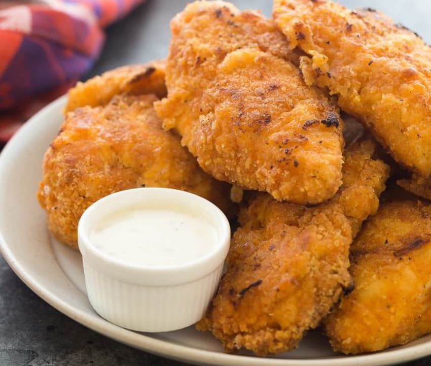 Cuisses et ailes de poulet panées