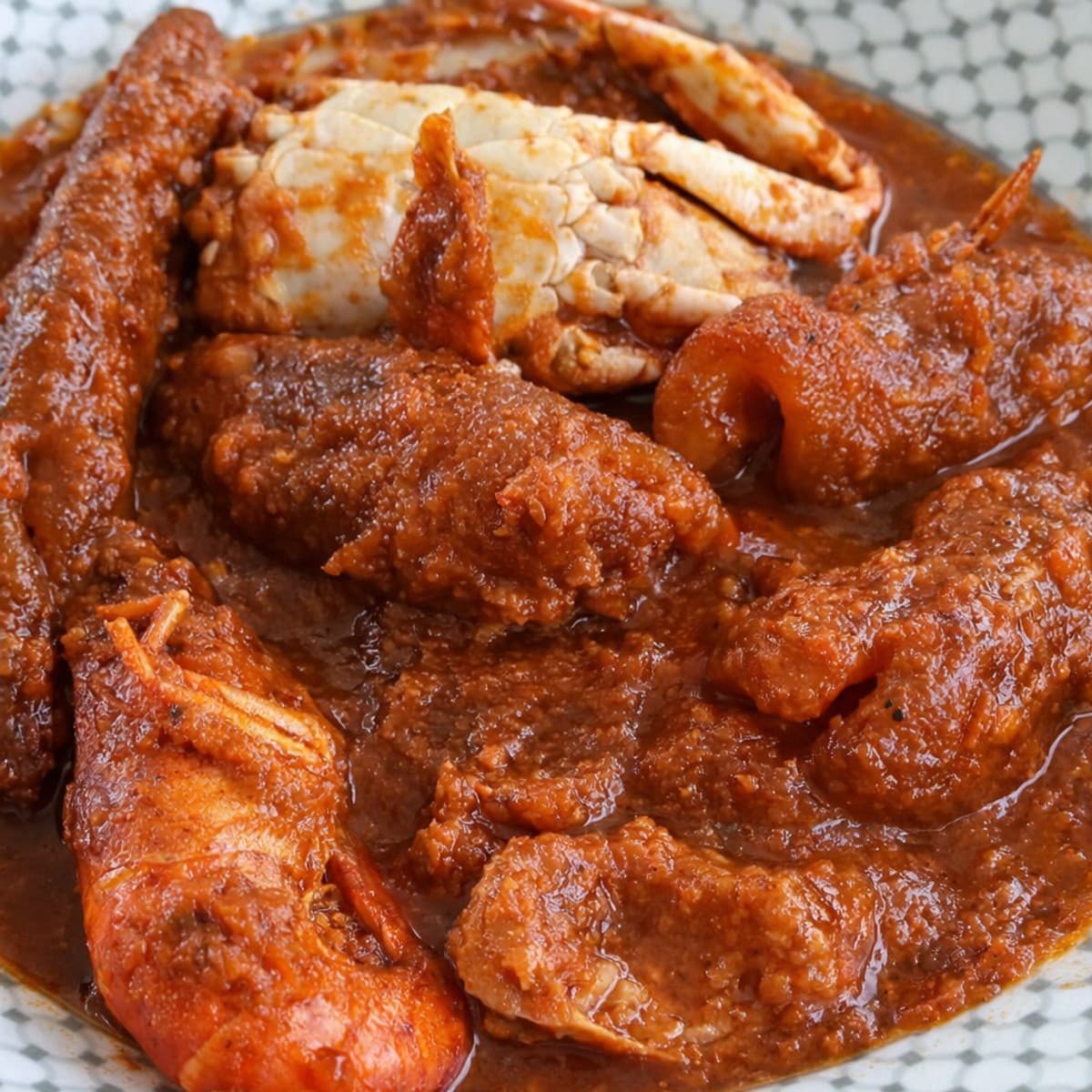 Sauce tomate épicée, crabes kplos et écrevisses